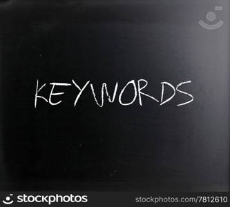 ""Keywords" handwritten with white chalk on a blackboard."