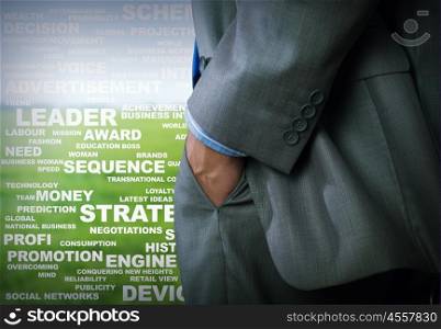Keywords of business. Bottom view of businessman with hands in pockets