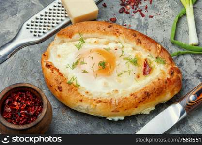 Khachapuri Georgian national flour product, a pie stuffed with cheese and eggs.Traditional Georgian cuisine meal. Khachapuri - Georgian dish