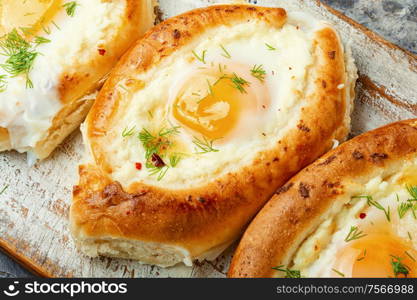 Khachapuri Georgian national flour product,pie stuffed with cheese and eggs. Khachapuri - Georgian dish