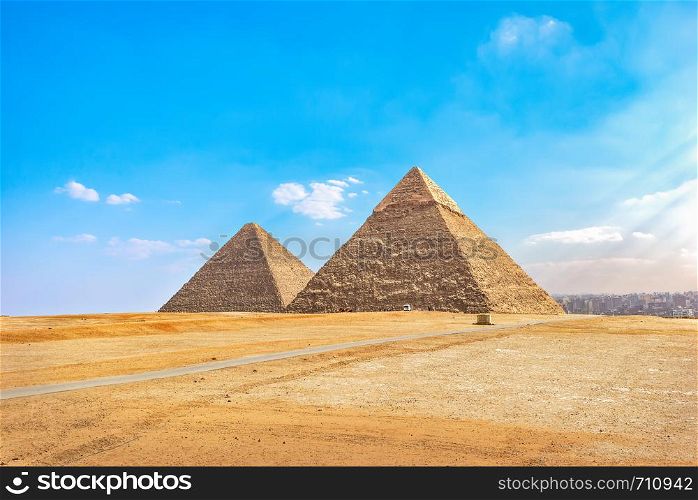 Khafre and Cheops pyramids in desert of Giza at summer day, Cairo. Khafre and Cheops pyramids