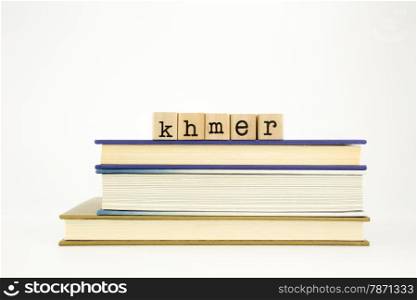 khmer word on wood stamps stack on books, academic and language concept