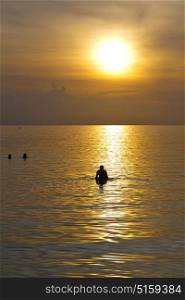 kho phangan sunrise people boat and water in thailand bay coastline south china sea
