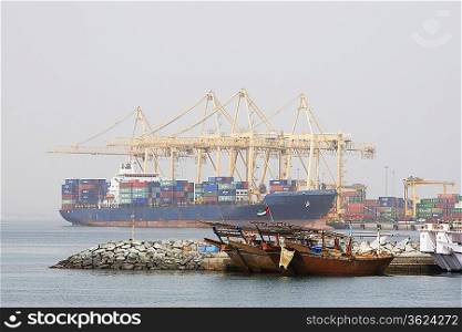 Khor Fakkan, UAE, Large cargo ships docked to load and unload goods at Khor Fakkport