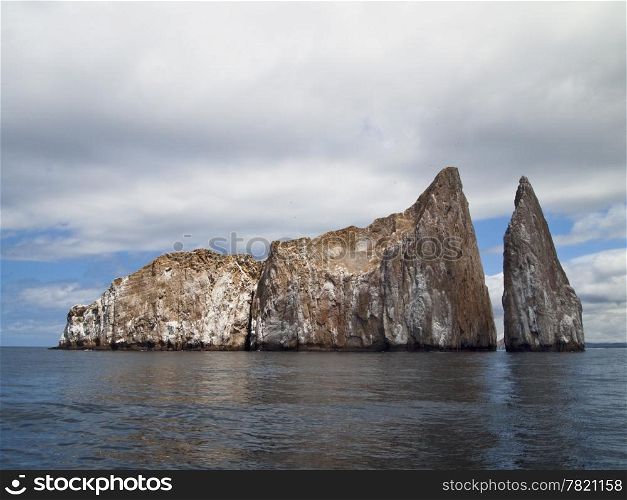 Kicker Rock, or Leon Dormido, is a desolate, barren rock off San Cristobal Island in the Galapagos that is a favored spot for snorkeling and scuba diving.
