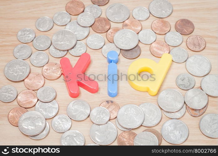 Kid alphabet with various US coins, stock photo