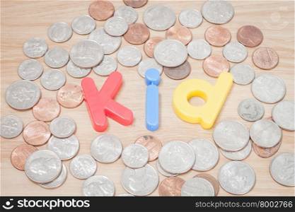 Kid alphabet with various US coins, stock photo