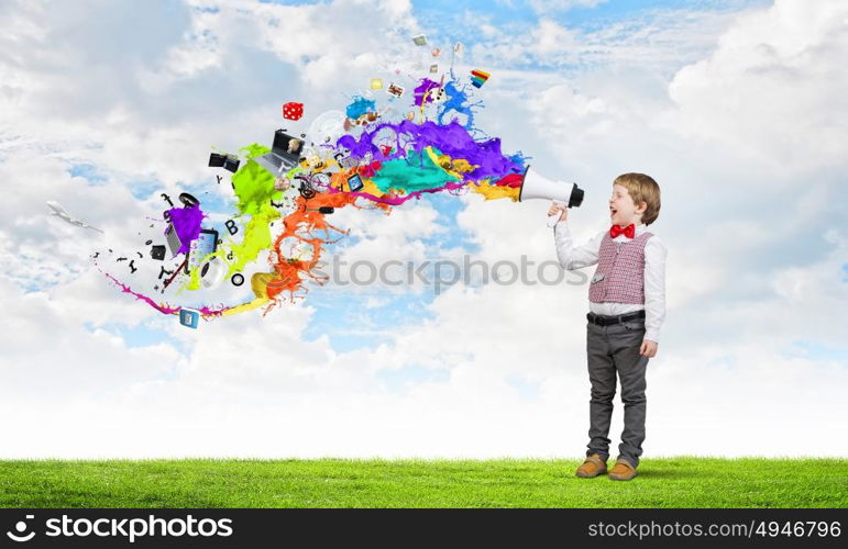 Kid boy with megaphone. Little sweet boy screaming emotionally into megaphone