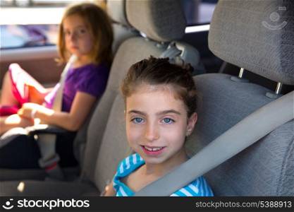 Kid children girls with safety belt in car vehicle indoor