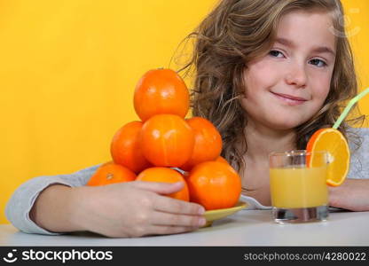 Kid drinking orange juice.