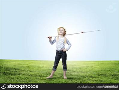 Kid fisherman. Cute girl with fishing rod on shoulder
