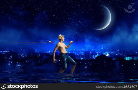 Kid fisherman. Young boy at night with fishing rod