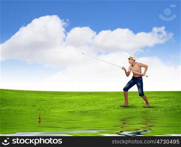 Kid fisherman. Young boy fishing with rod on lake bank