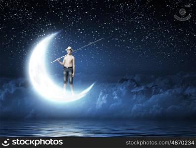 Kid fisherman. Young boy standing on moon with fishing rod