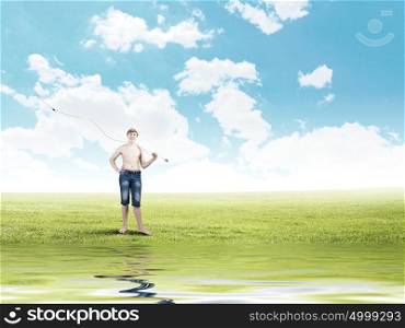 Kid fisherman. Young boy with fishing rod on shoulder