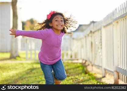 kid girl toddler playing running in park outdoor latin ethnicity