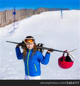 Kid girl winter snow holding ski equipment helmet goggles