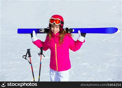 Kid girl winter snow holding ski equipment helmet goggles poles