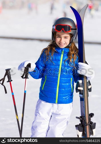 Kid girl winter snow with ski equipment helmet goggles poles