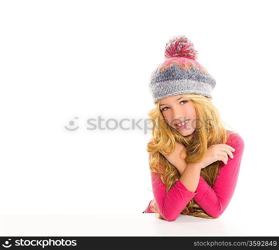 Kid girl with winter wool cap happy smiling on white background