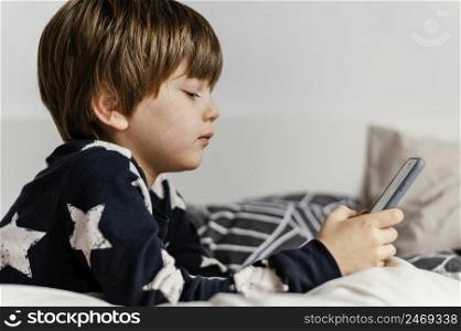 kid holding phone