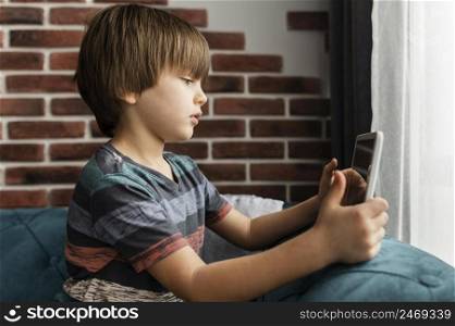 kid holding tablet