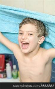kid in bath towel in bathroom play