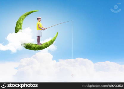 Kid on moon. Little boy stay on moon and fishing