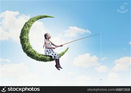 Kid on moon. Little girl standing on moon and fishing