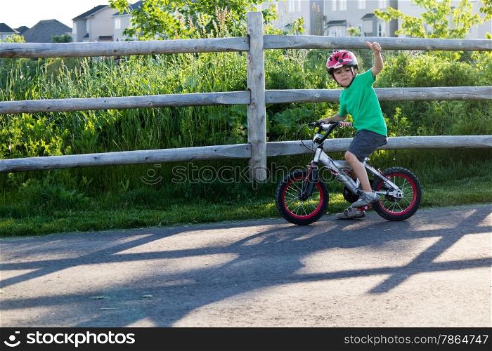 Kid riding his bicycle at the park
