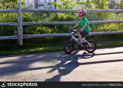 Kid riding his bicycle at the park
