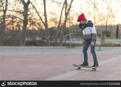 Kid skateboarder doing a skateboard trick.