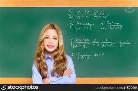 kid smart student girl with difficult math formula on green school blackboard