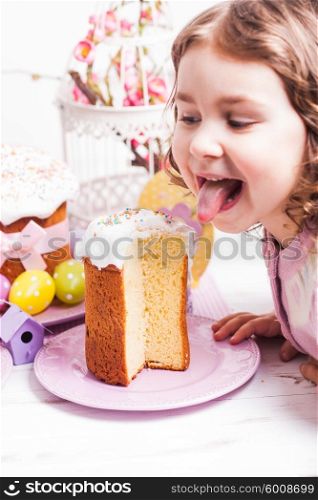 Kid with easter cake want to eat it. Kid with easter cake