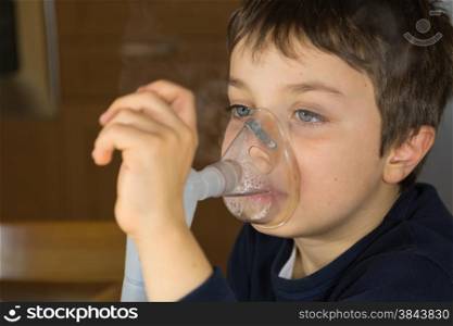 kid with mask for inhalations