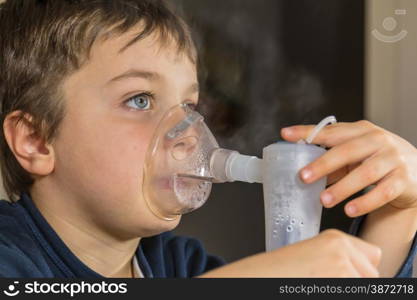 kid with mask for inhalations