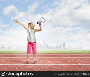 Kid with megaphone. Image of little girl shouting into megaphone