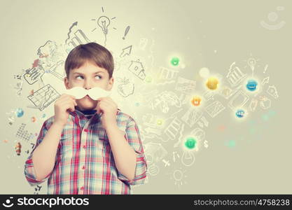 Kid with mustache. Cute boy wearing shirt and paper mustache