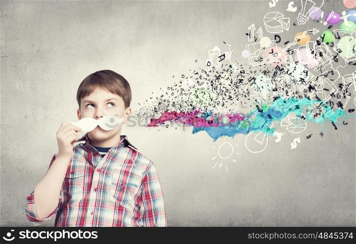 Kid with mustache. Cute boy wearing shirt and paper mustache