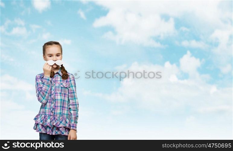 Kid with mustache. Cute girl wearing shirt and paper mustache