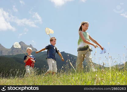 Kids Catching Bugs in Field