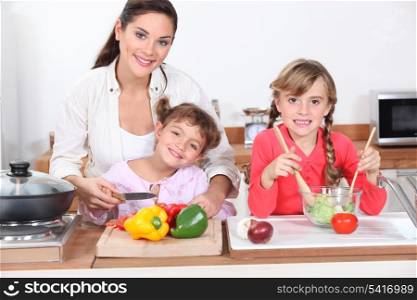 Kids cooking with their mother