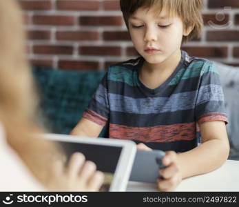 kids holding devices indoors