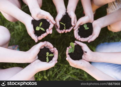 kids holding their hands clover . Resolution and high quality beautiful photo. kids holding their hands clover . High quality and resolution beautiful photo concept