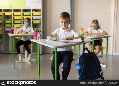 kids keeping social distance classroom