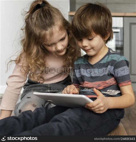kids looking tablet
