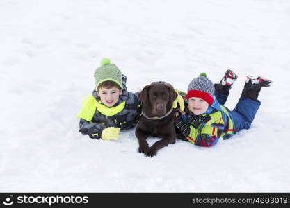 Kids of school age with dog in winter park. My best friend and I