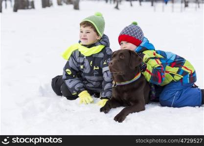 Kids of school age with dog in winter park. My best friend and I