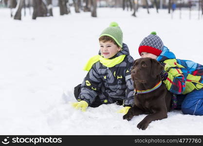 Kids of school age with dog in winter park. My best friend and I