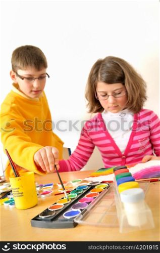 kids painting with watercolor
